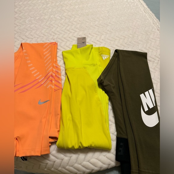 Hello, I’m selling my Nike leggings NWT & some NWOT the yellow/red are adidas .. - Picture 4 of 4